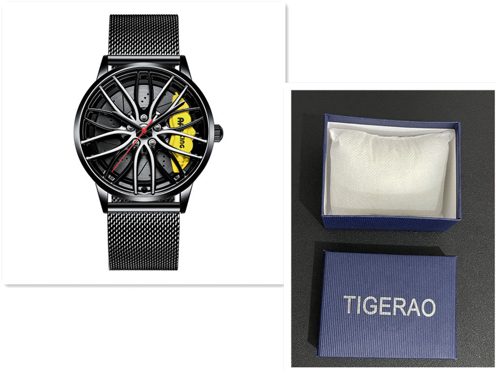 Black watch with detailed face and mesh band, displayed with a branded box on a white background.