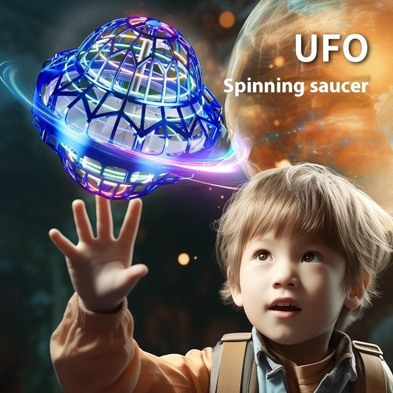 Child holding a UFO spinning saucer toy with a space-themed background