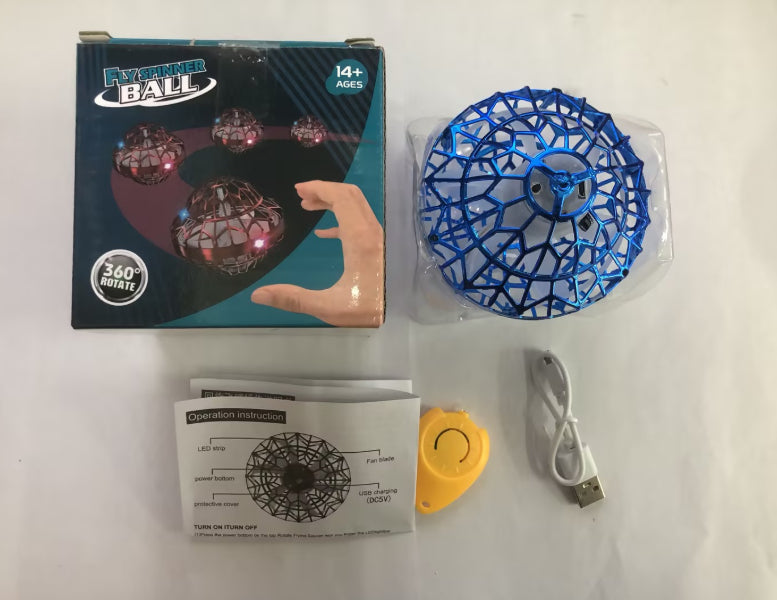 Blue glowing ball with packaging, USB cable, and manual on a white background