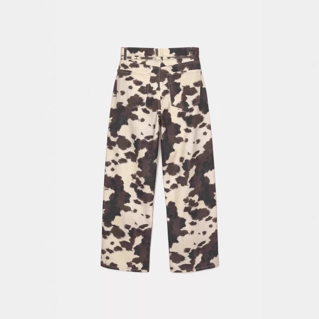 Cow print pants on a white background