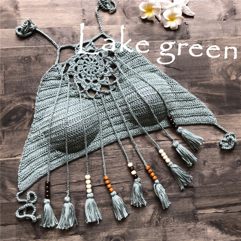 Crocheted top with tassels and beads on a wooden surface, featuring the brand 'Lake Green'.