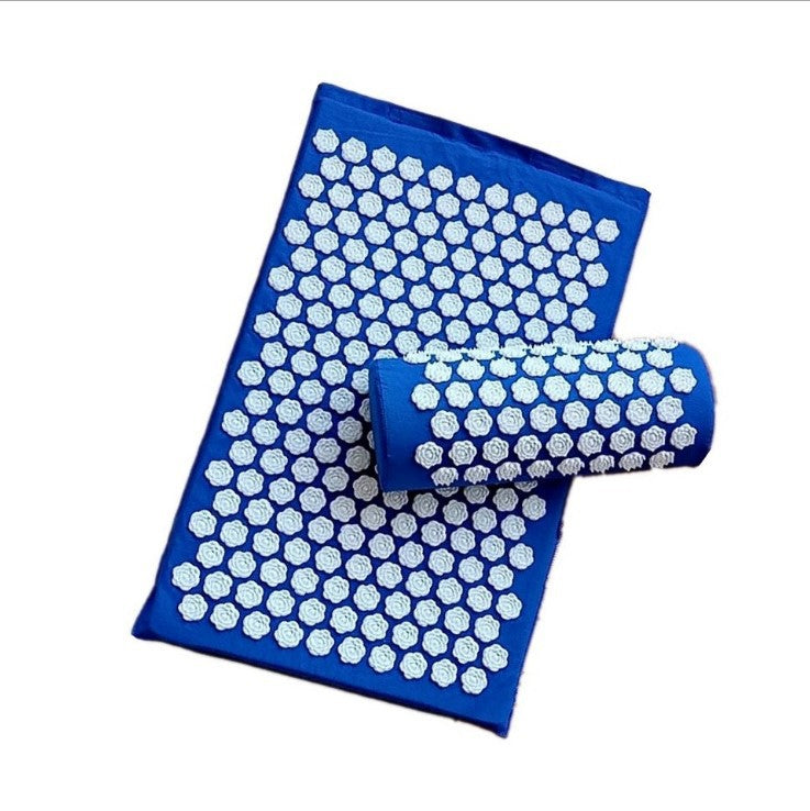 Blue acupressure mat with white dots and a cylindrical roller on a white background