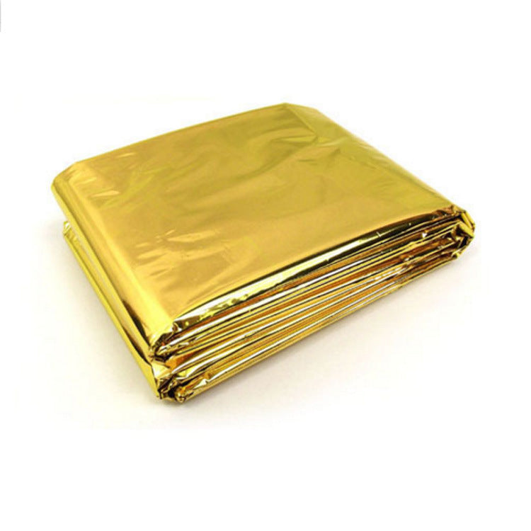 Folded gold mylar sheet on a white background