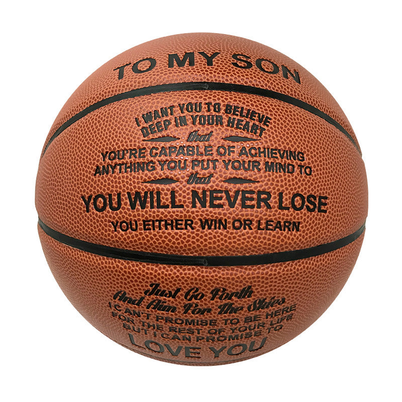 A brown basketball with black printed motivational text reading 'TO MY SON' and inspirational quotes, shown on a plain white background.
