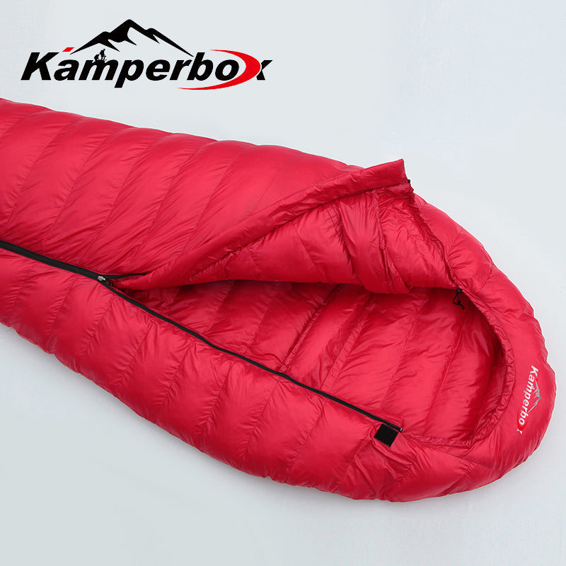 Red sleeping bag with Kamperbox logo on a light gray background