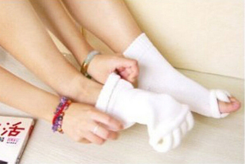 White socks being worn with a focus on the feet and lower legs.