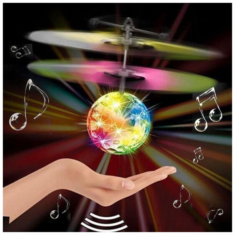 Colorful glowing ball with spinning propellers held in a hand against a dark background with musical notes.