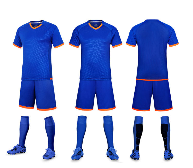 Blue soccer uniform with shorts, jersey, socks, and shoes on a white background