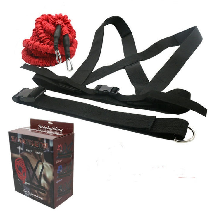 Black resistance band with red sandbag and packaging on a white background