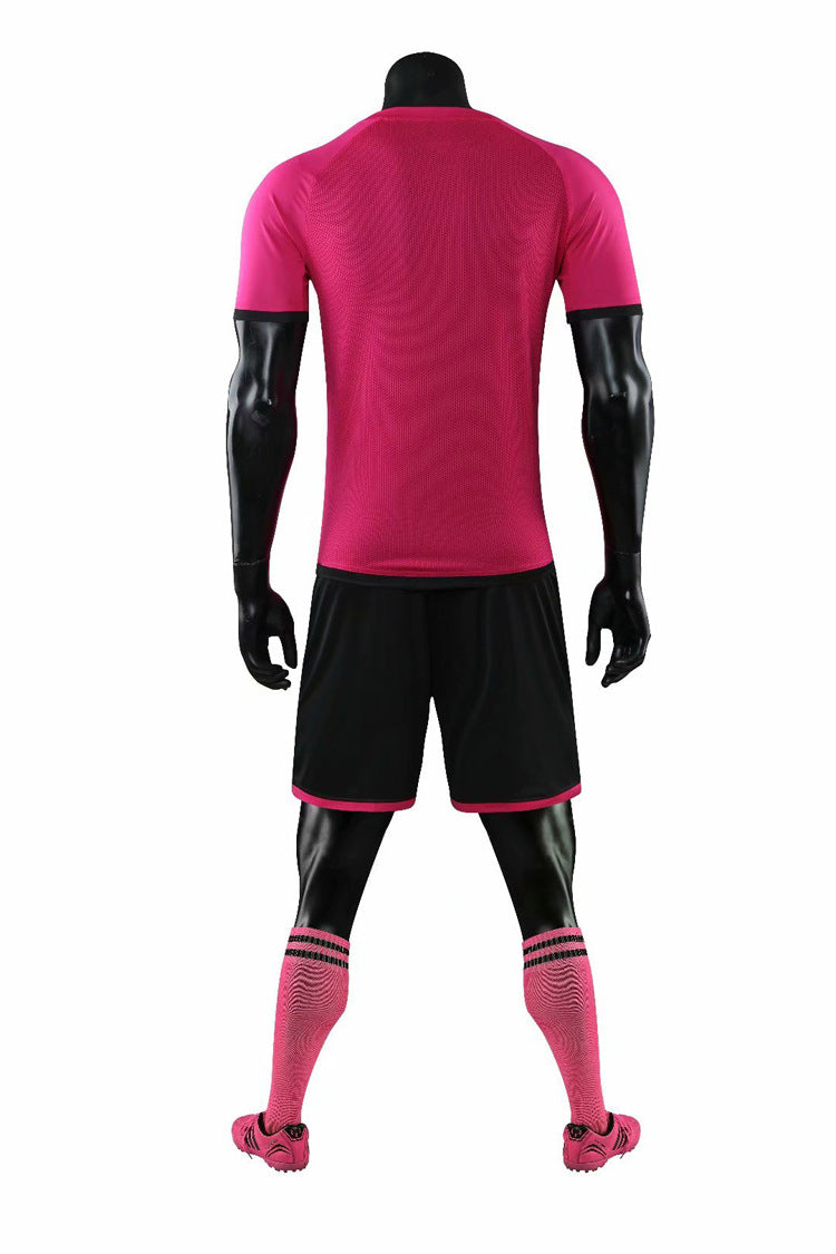 Mannequin wearing a pink and black sports outfit on a white background