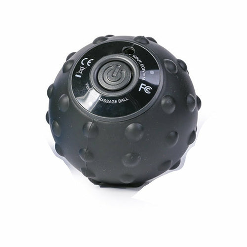 Black massage ball with control button on a white background