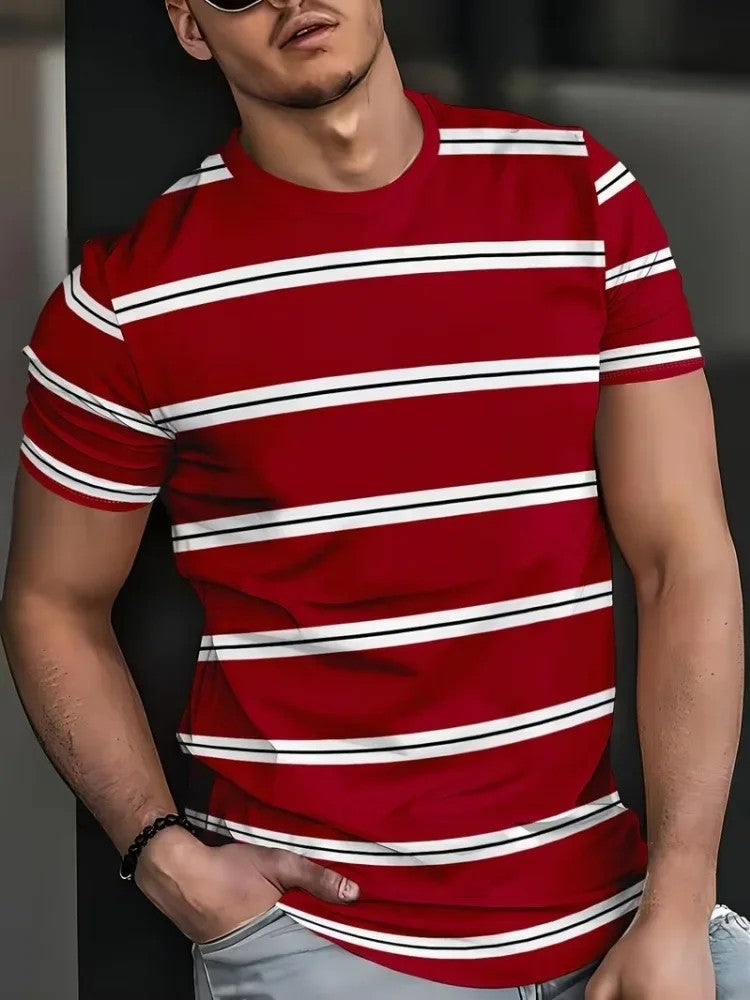 A man wearing a red short-sleeve crewneck t-shirt with horizontal white and black stripes, paired with light gray jeans.