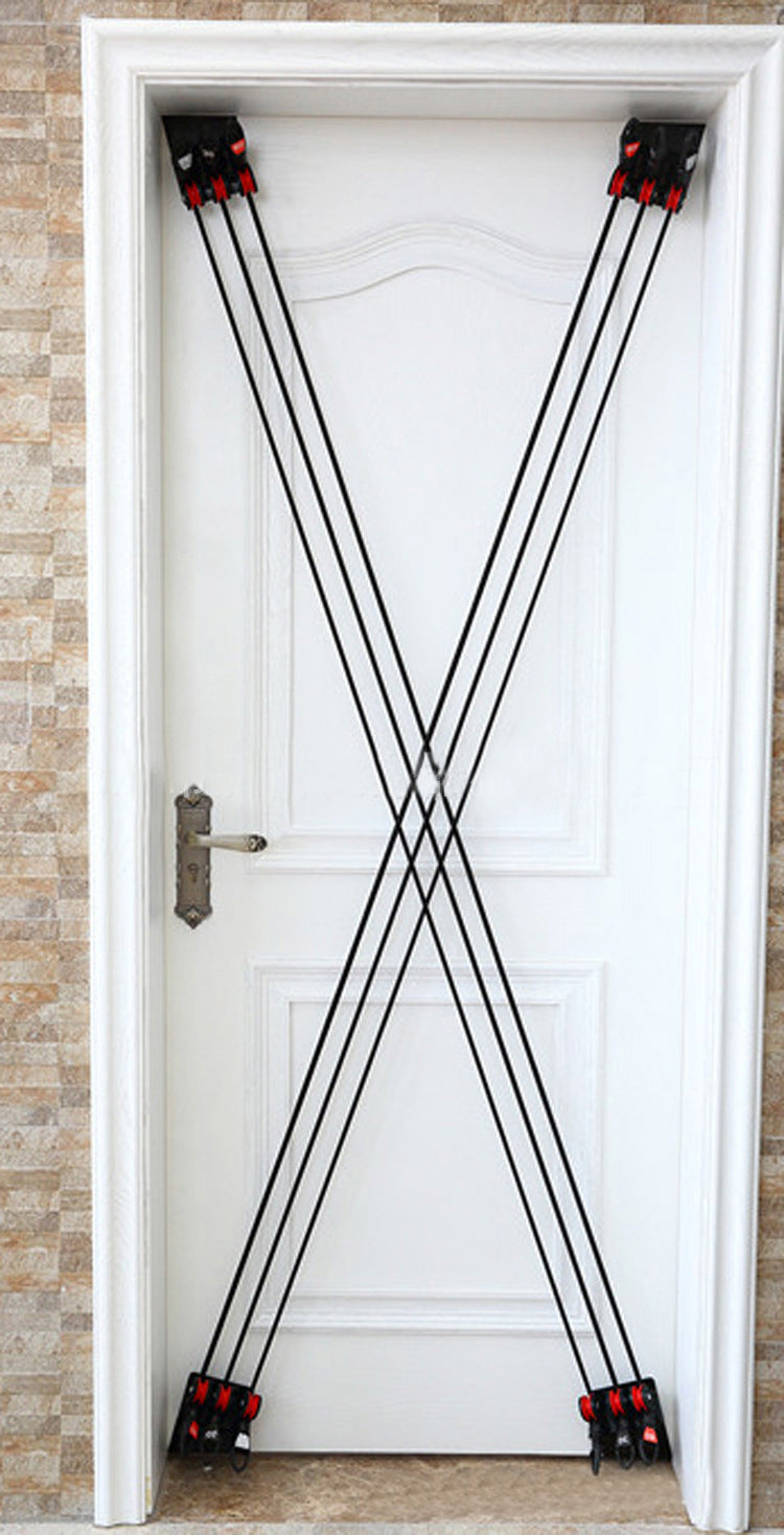 Black resistance bands arranged in an 'X' shape on a white door.