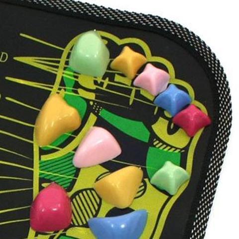 Colorful geometric earrings on a black case with abstract design