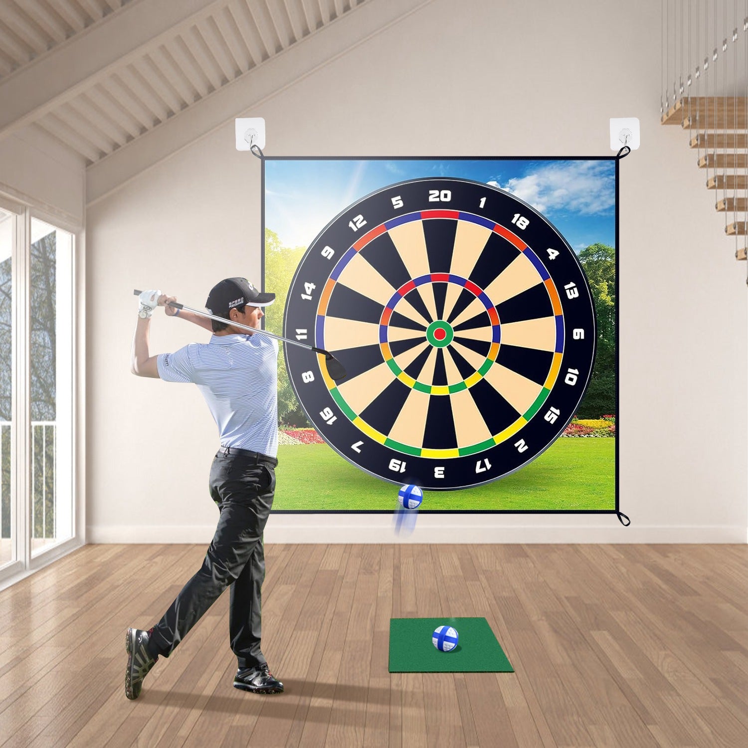Man practicing golf swings in front of a large screen displaying a golf course.