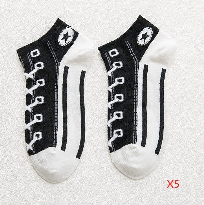 Two pairs of black and white socks with shoe lace design on a light gray background.