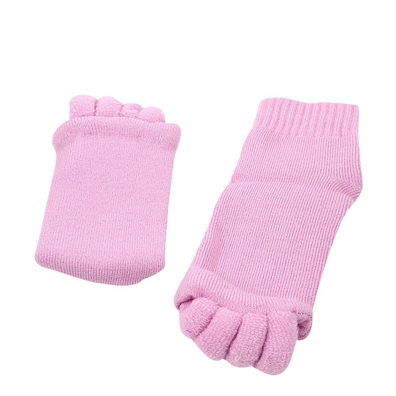 Pair of pink toe-separated socks on a white background