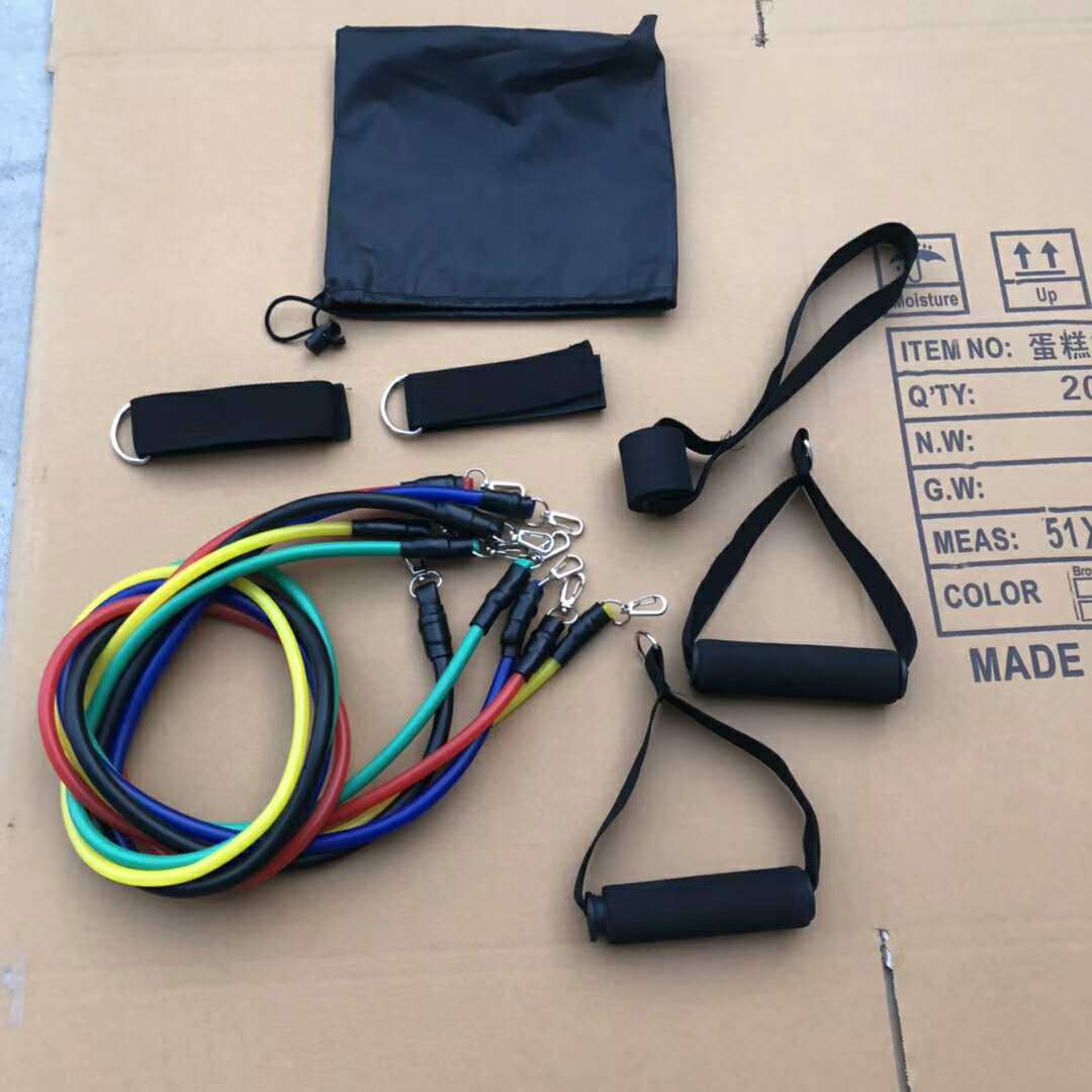 Resistance bands and accessories on a cardboard surface