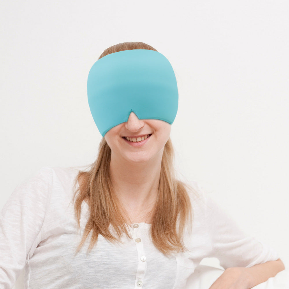 Person wearing a blue sleep mask on a white background
