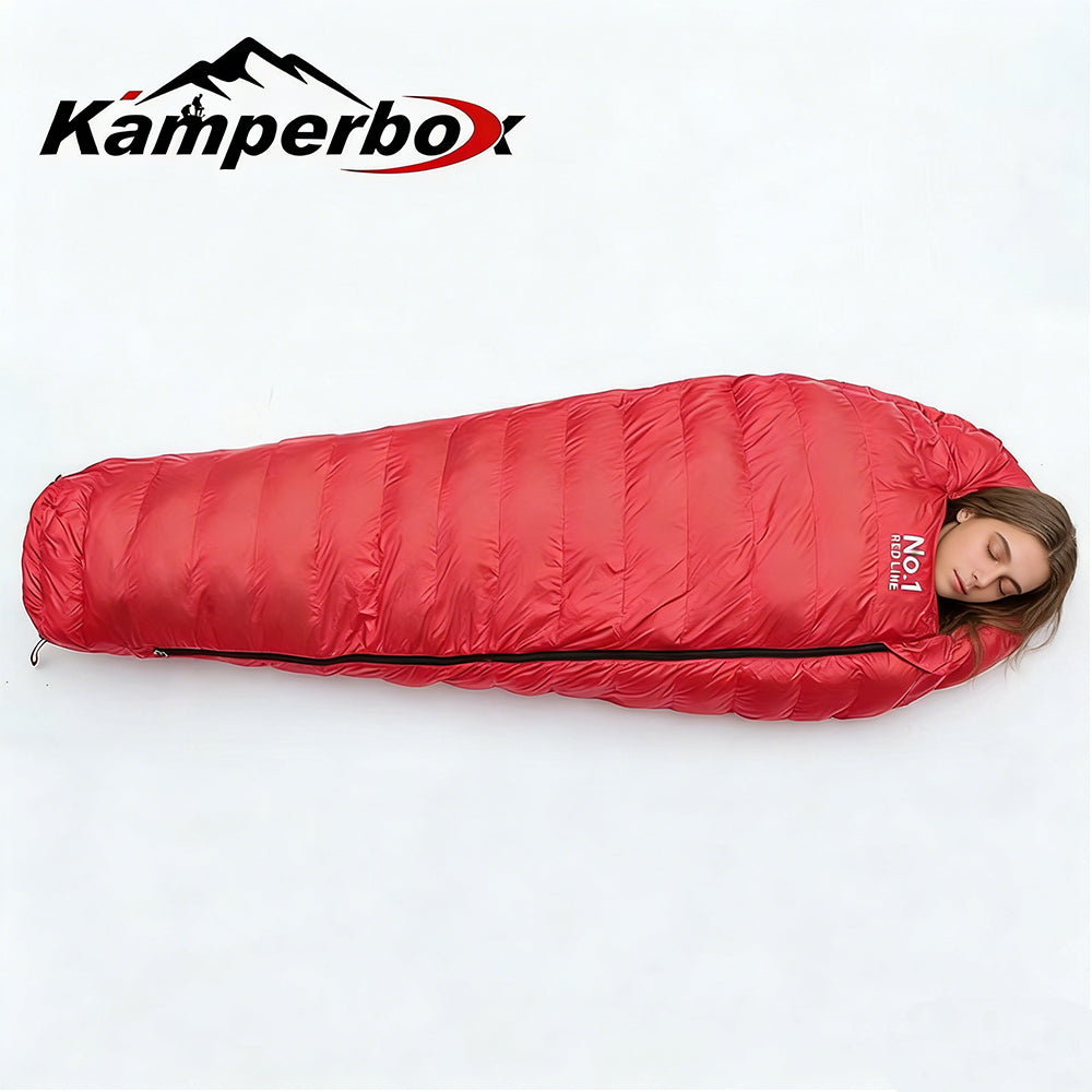 Red sleeping bag with a person partially visible, Kamperbox logo above