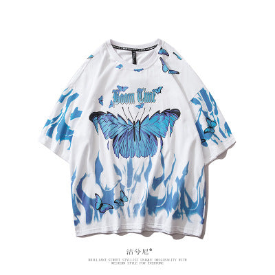 White t-shirt with blue butterfly design on a white background