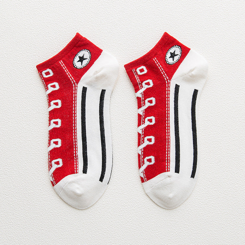 Red and white socks with black stripes and a brand logo on a light gray background