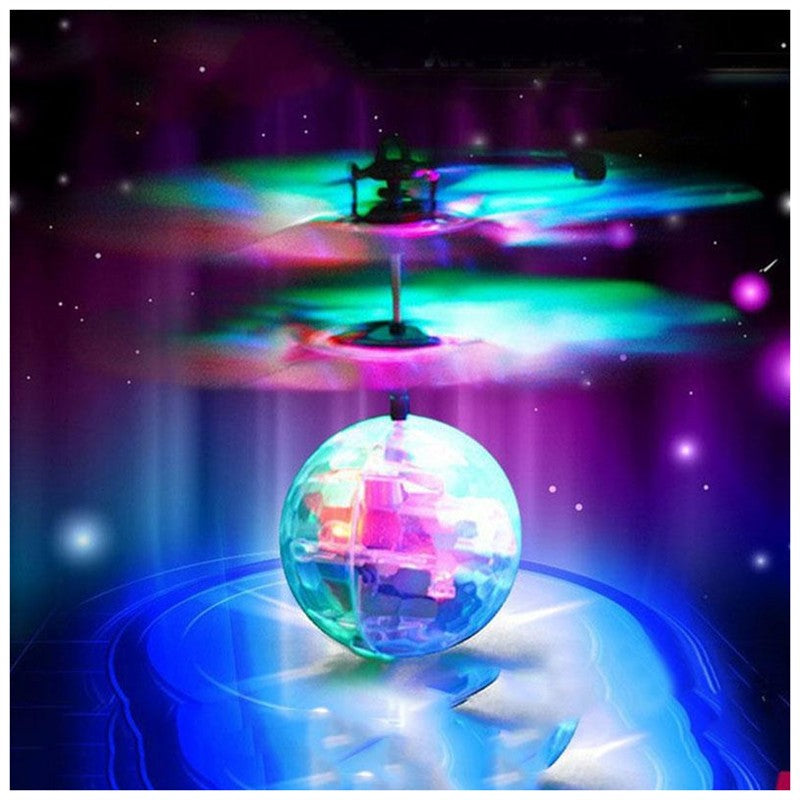 Colorful LED flying ball with spinning top against a dark background
