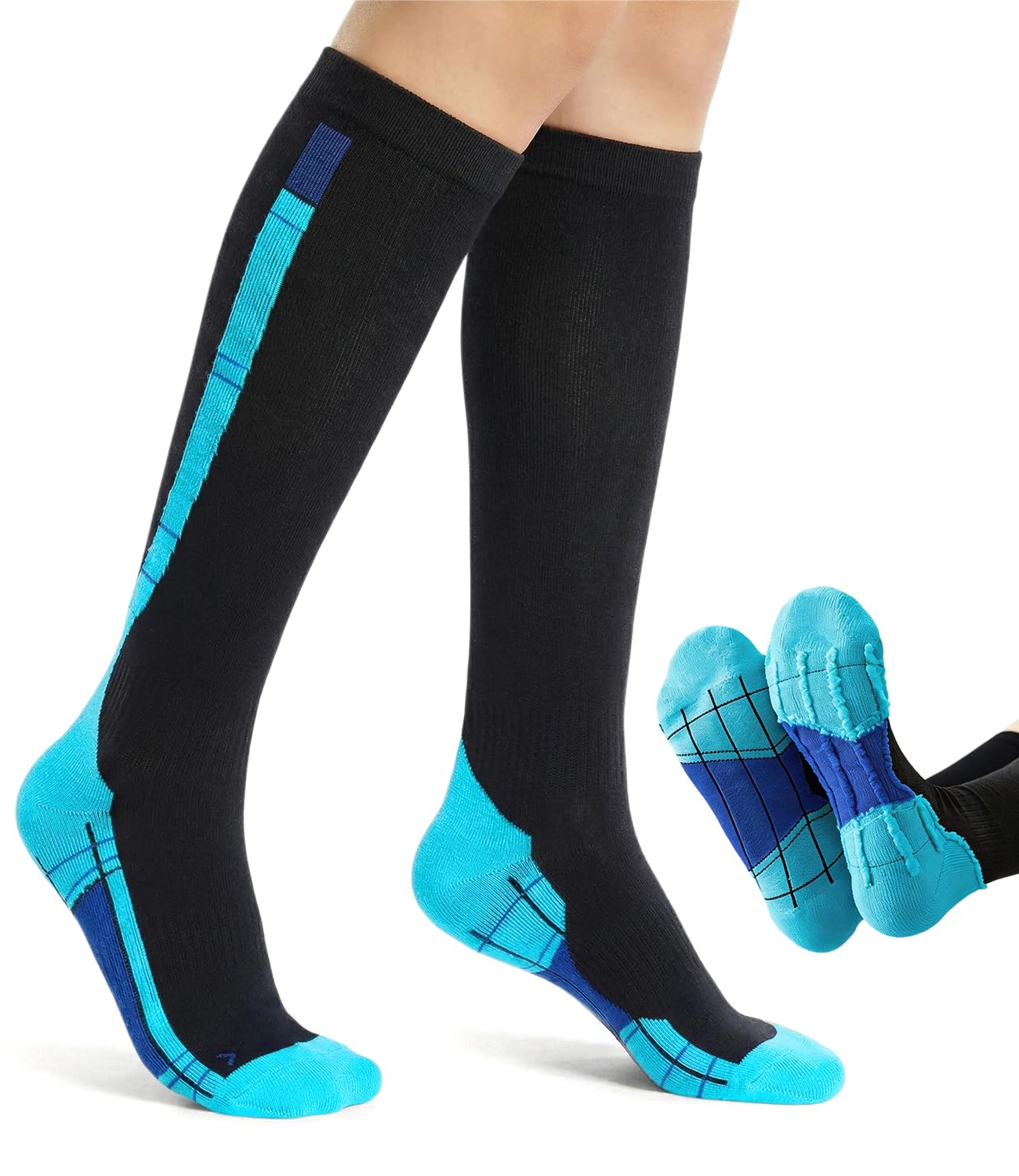 Black knee-high compression socks with bright blue and dark blue accents, shown worn on legs with a small inset of the socks folded to show the sole design, on a white background.