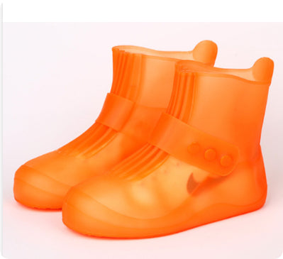 Orange rain boots on a white background