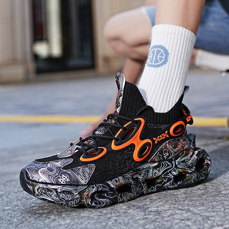 Black and orange sneaker with unique sole design on a street background