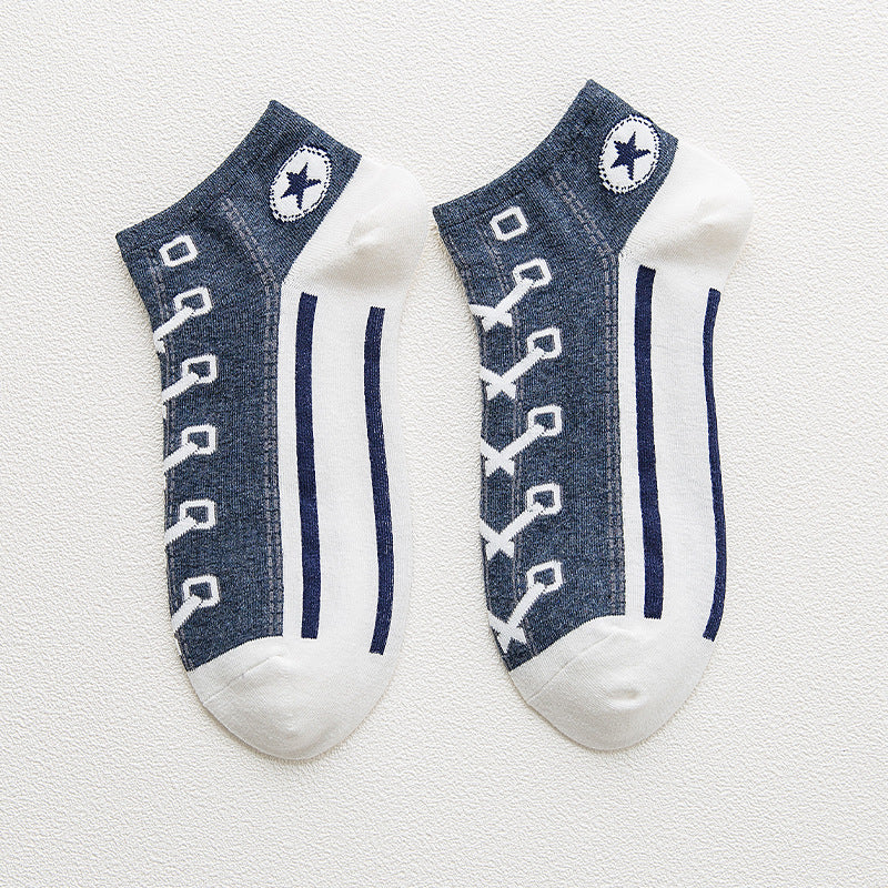 Two pairs of socks with denim lace design on a light gray background