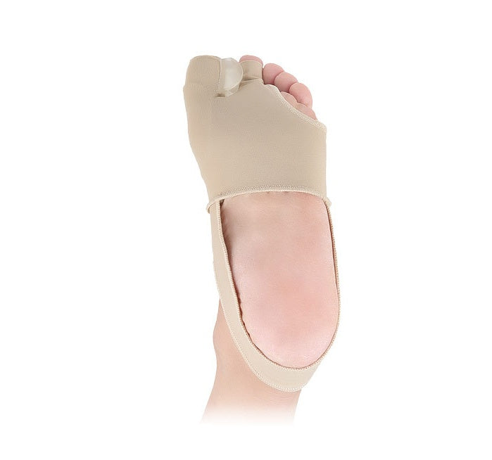 Beige bunion corrector on a foot against a white background
