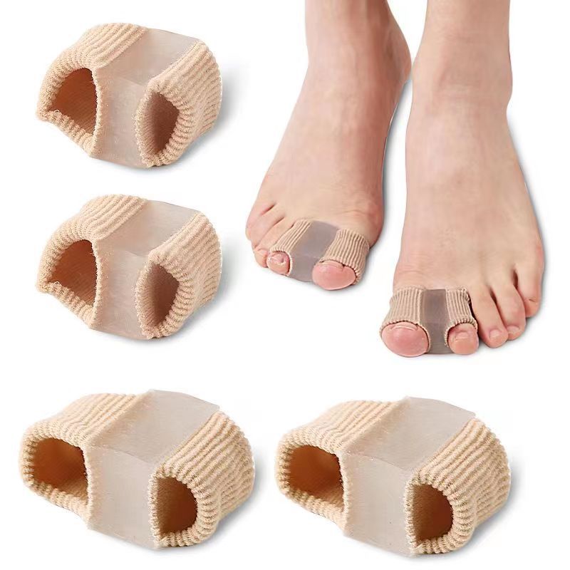 Beige toe separators with a close-up of feet wearing them on a white background