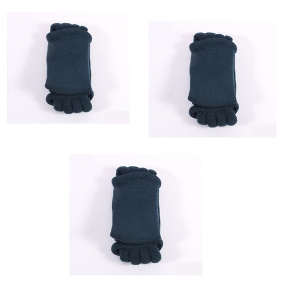 Three pairs of dark blue socks with ruffled cuffs on a white background