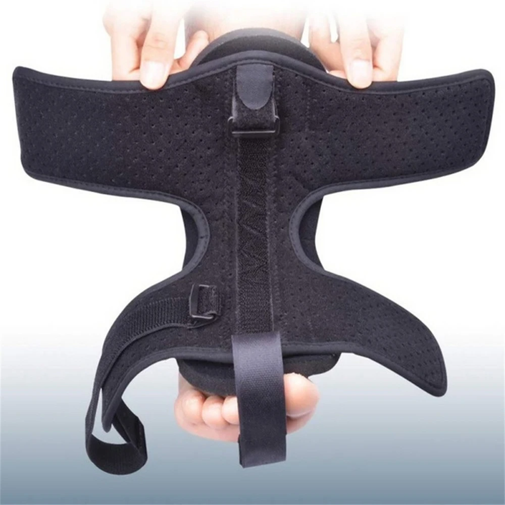 Black brace held by hands on a white background
