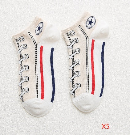 Two pairs of socks with shoe lace design on a textured white background