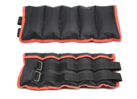 Black and orange ankle weight on a white background