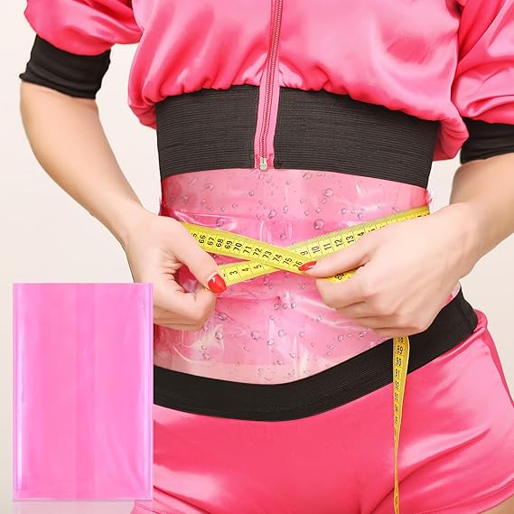 A person wearing a pink and black athletic outfit measures their waist with a yellow tape measure, with a translucent pink water-resistant belly band visible around the waist. A small inset in the lower left shows a solid pink rectangular item, likely part of the product set.