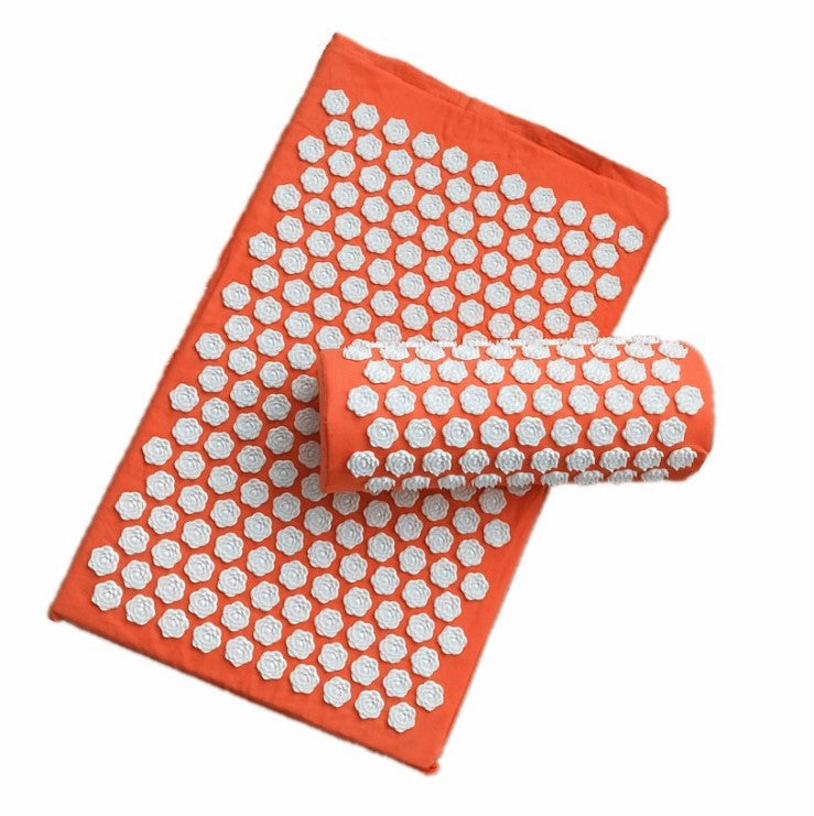 Orange acupressure mat with white hexagonal nodes on a white background