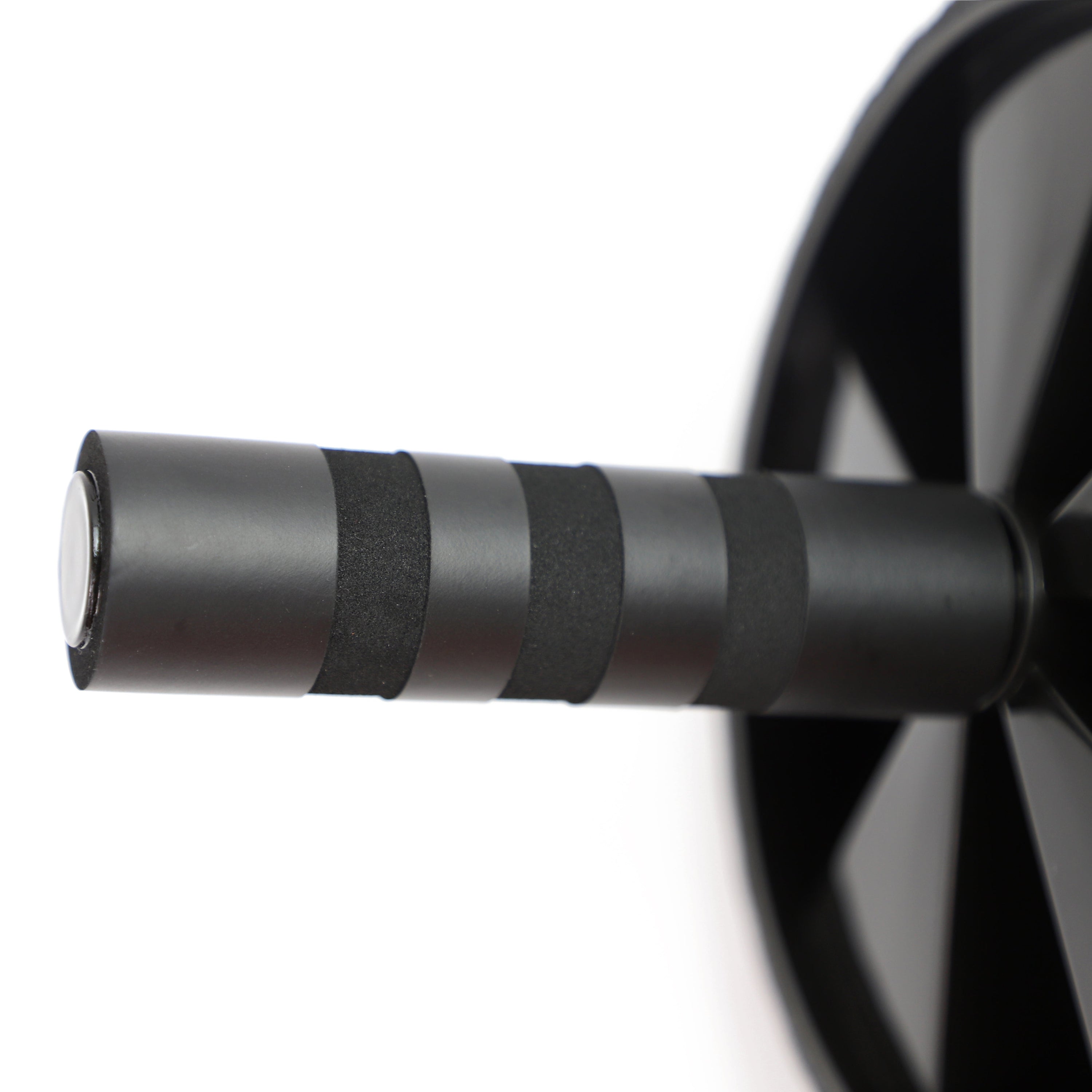 Close-up of a black bicycle wheel with a white rim on a white background