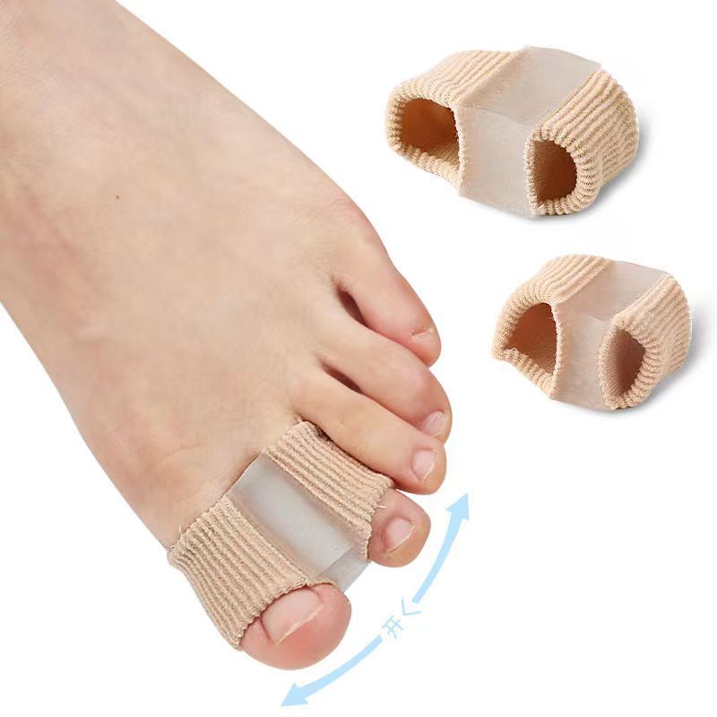 Beige bunion correctors on a foot with a white background
