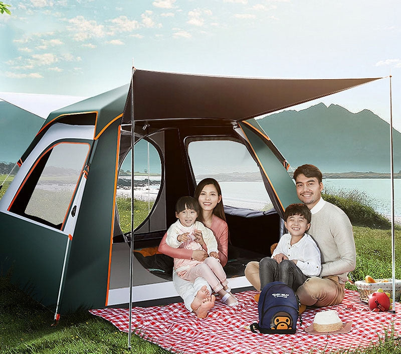 Family sitting outside a camping tent with a scenic background