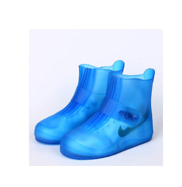 Blue rain boots with a visible brand logo on a light gray background