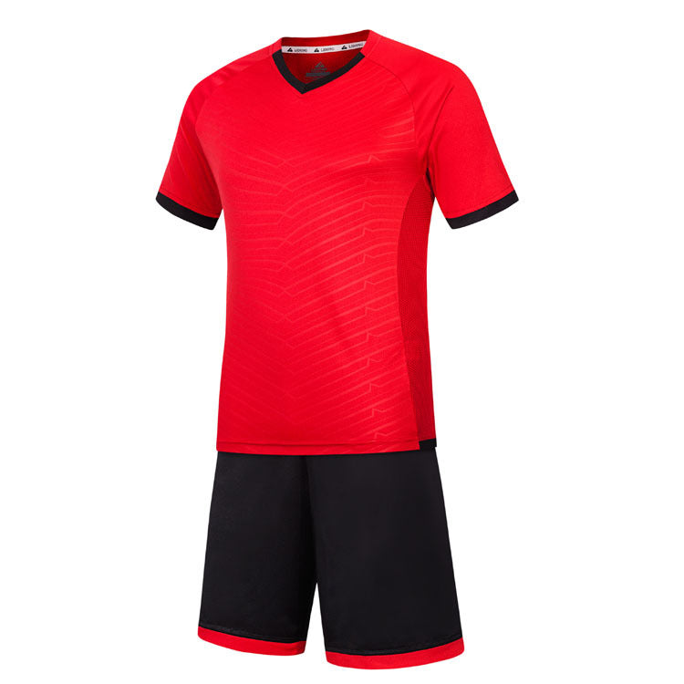 Red sports jersey with black shorts on a white background