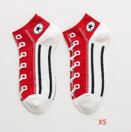 Two pairs of red and white socks with black stripes on a light gray background
