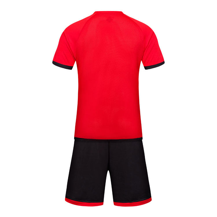 Red sports jersey and black shorts set on a white background