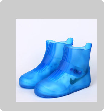 Blue rain boots with a Nike logo on a light gray background