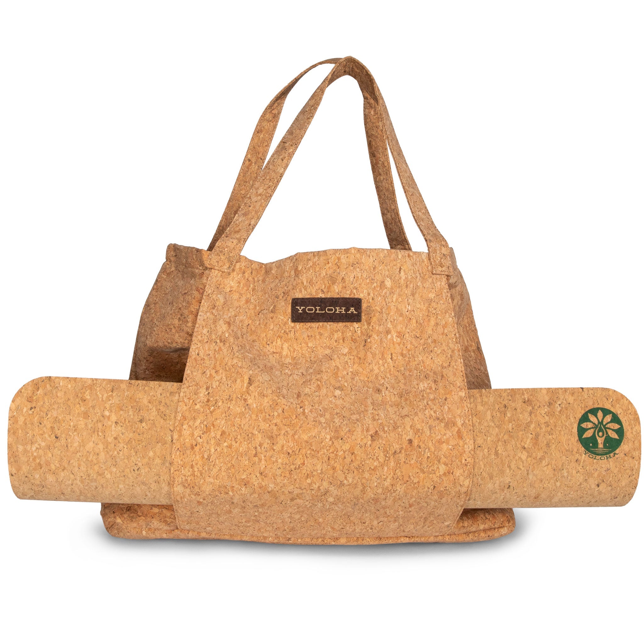 Cork yoga mat with carrying strap and visible brand logo on a white background