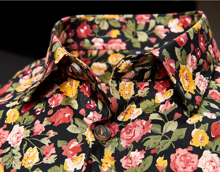 Close-up of a floral patterned shirt with colorful flowers on a dark background