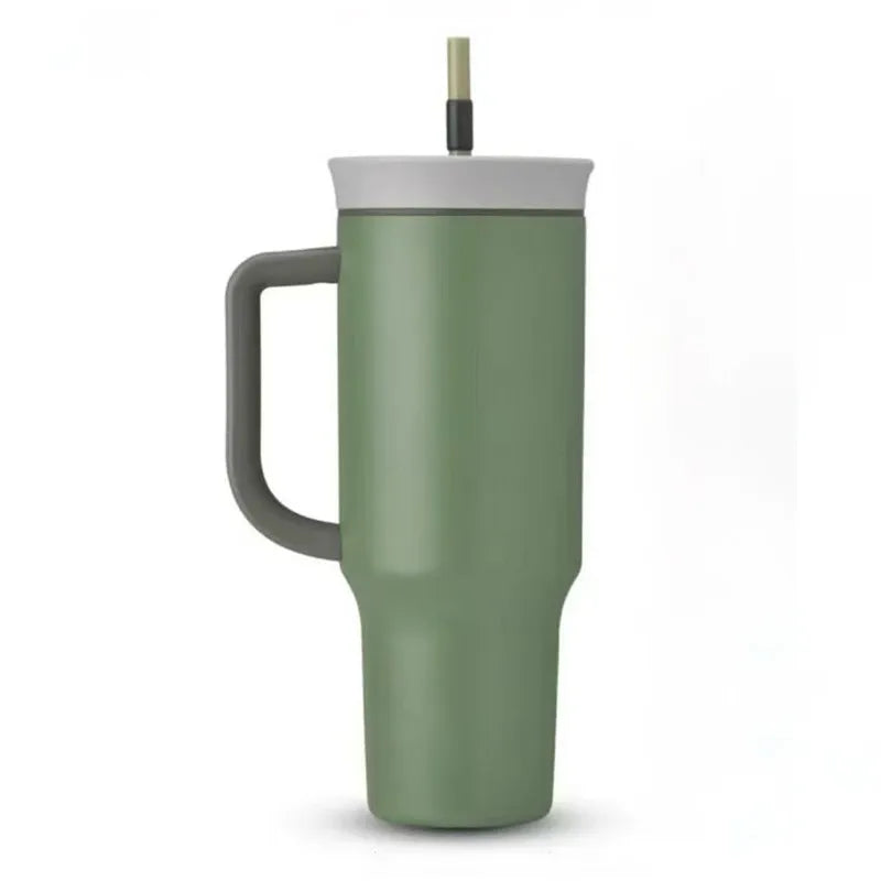 Sage-green travel tumbler with dark gray handle, light gray lid and straw on a white background.